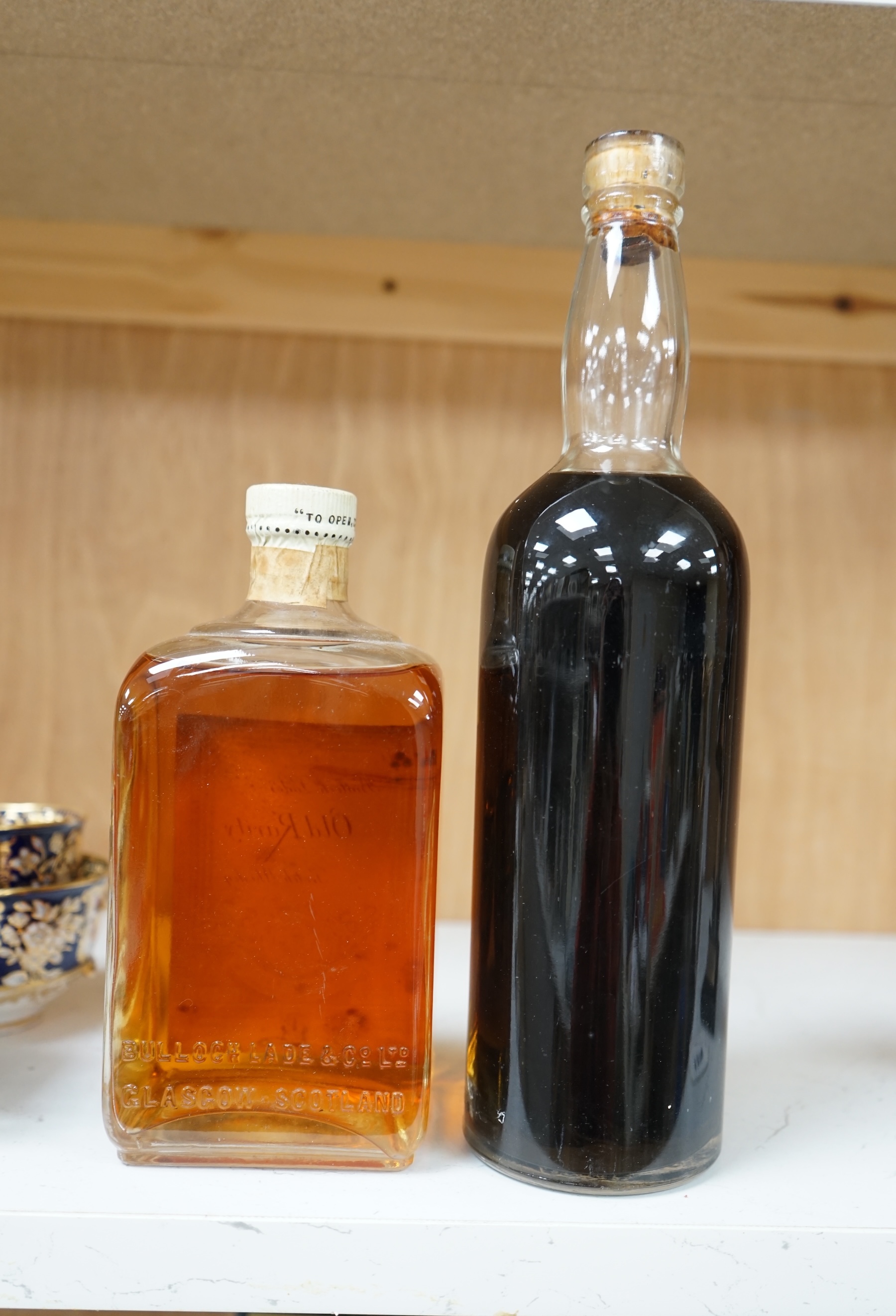 A bottle of Bulloch Lade’s Old Rarity Scotch Whisky and a bottle of Seager, Evans & Co, Ltd., Chaplins Ocean Wave finest old Rum, (2). Condition - fair, storage history unknown